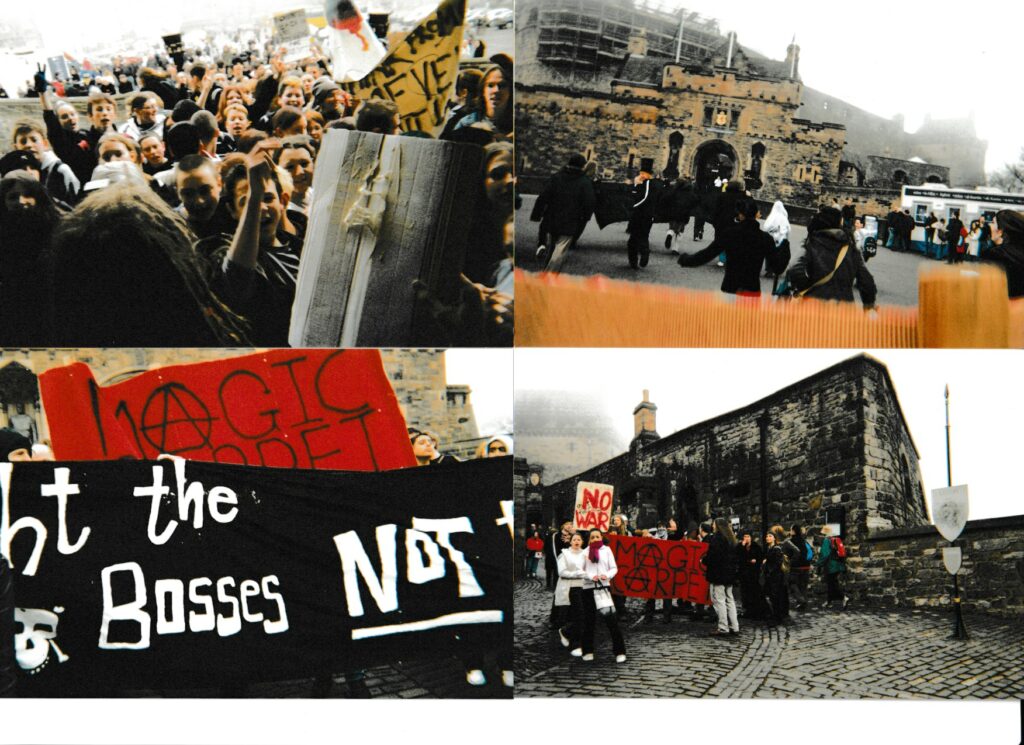 Young students protesting outside the edinburgh castle against the iraq war, with banners, one reads Magic Carpet with the a's replaced by an anarchist a symbol